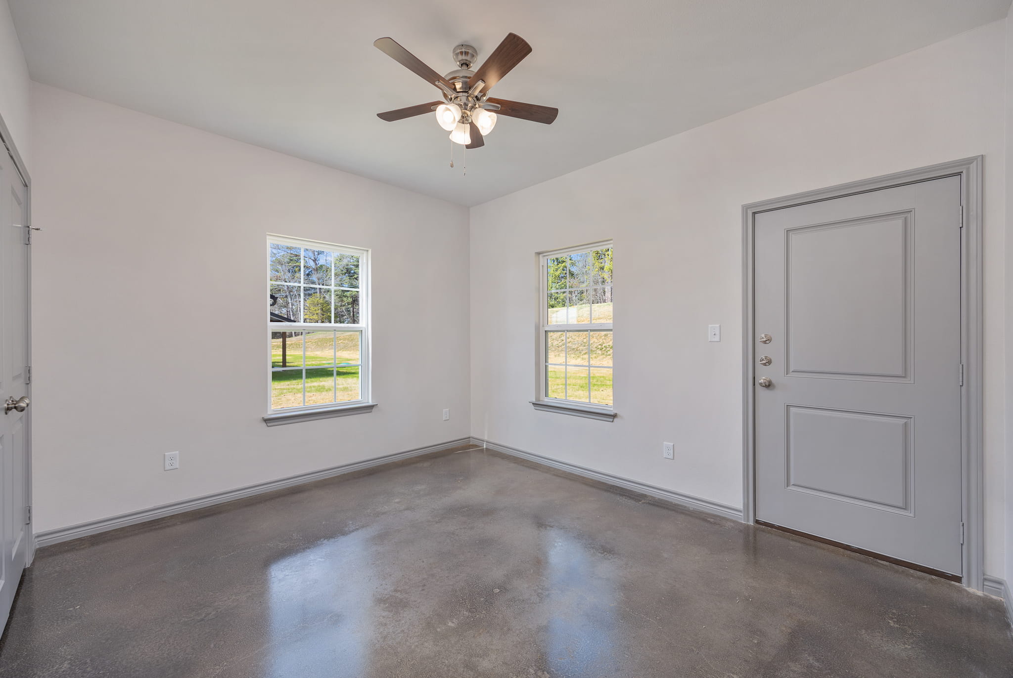 living room with shiny concrete floor
