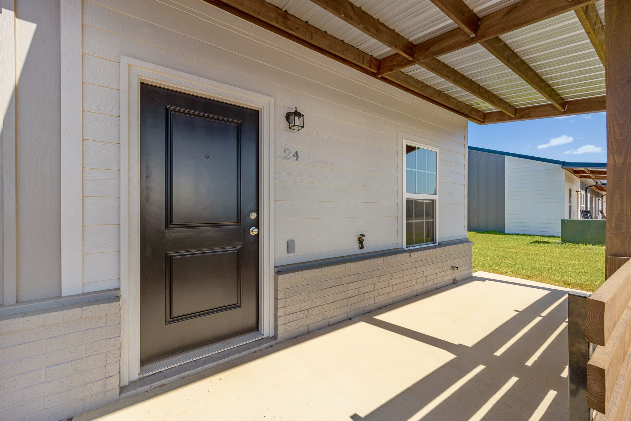 residential black front door and porch