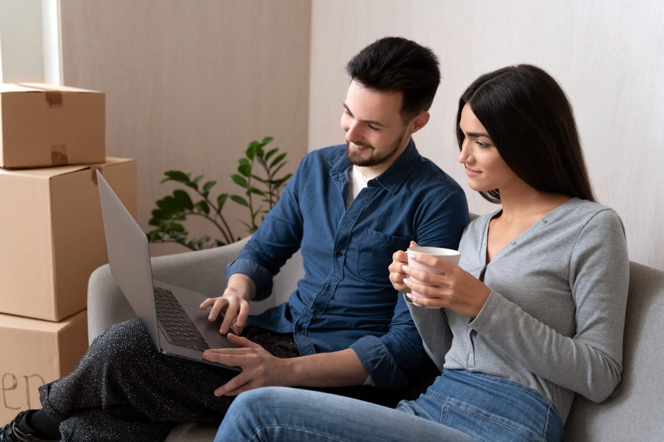 couple looking at online listings on a laptop