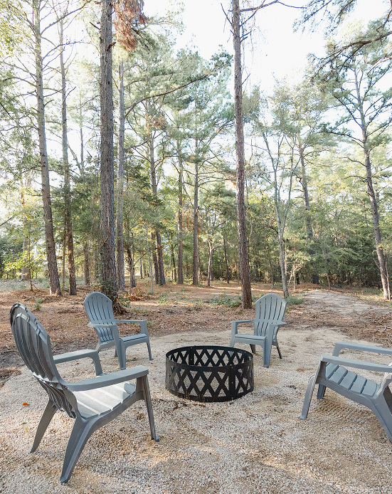 fire pit surrounded by chairs