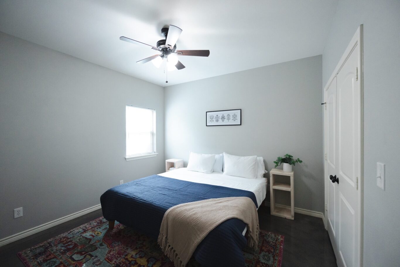 furnished bedroom with bed and rug
